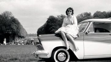 Women pose with cars 1960s