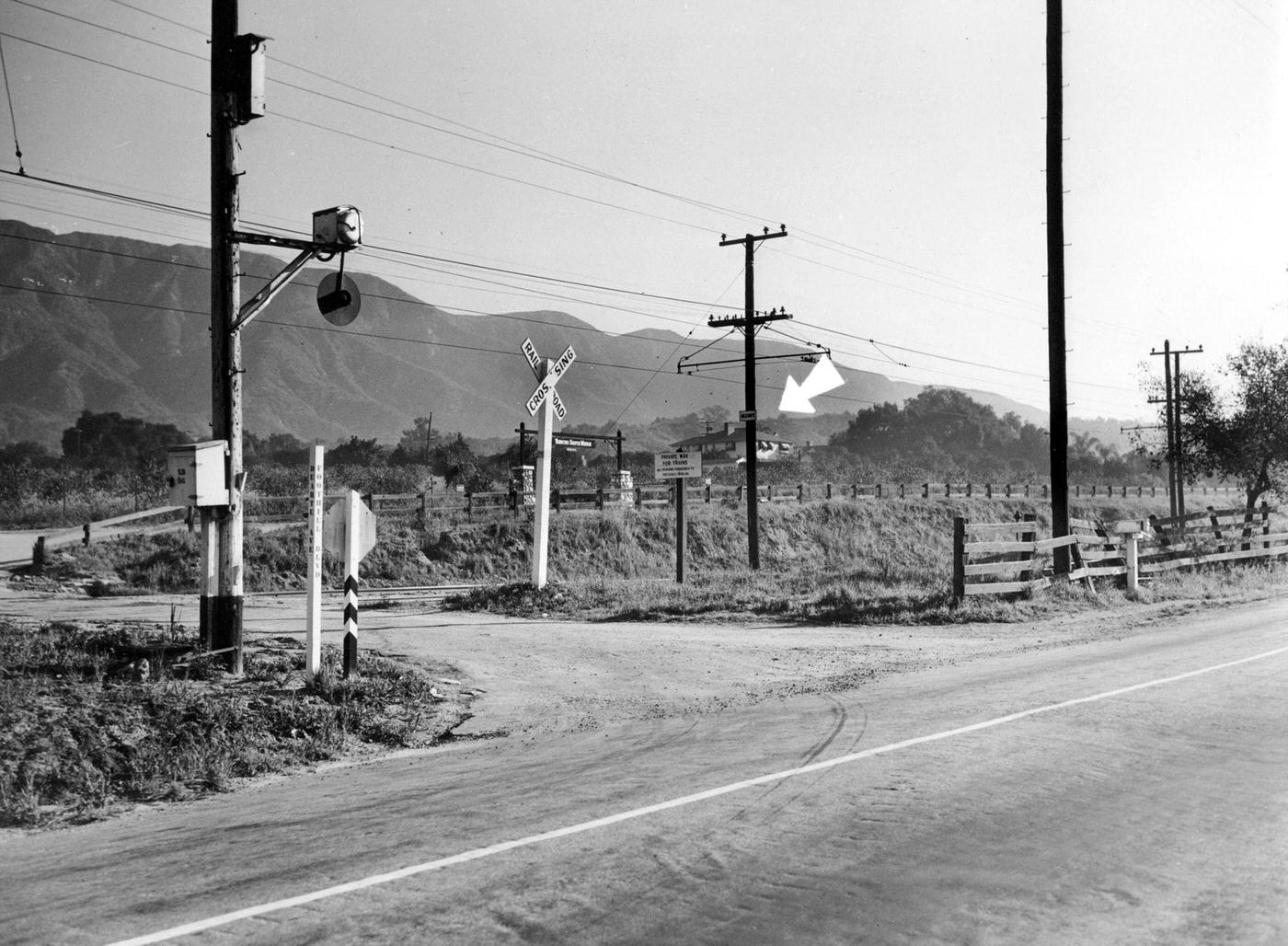 At this junction of two suburban roads, District Attorney Buron Fitts narrowly escaped death when ambushers fired shots that wounded him in the arm, 1936