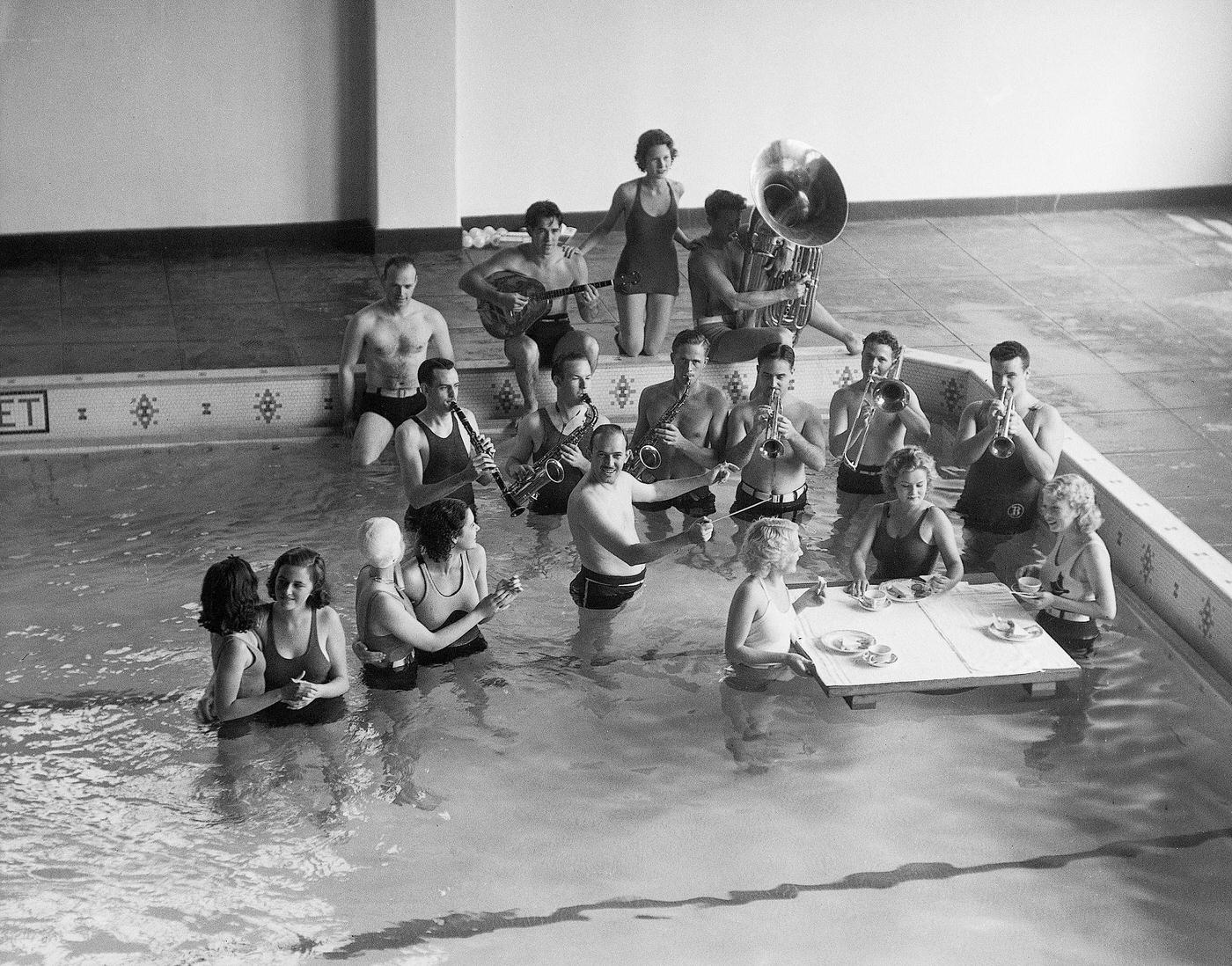 Jazz band playing in the swimming pool at the Santa Monica Hotel. There are girls eating and dancing as well - June 19, 1933.