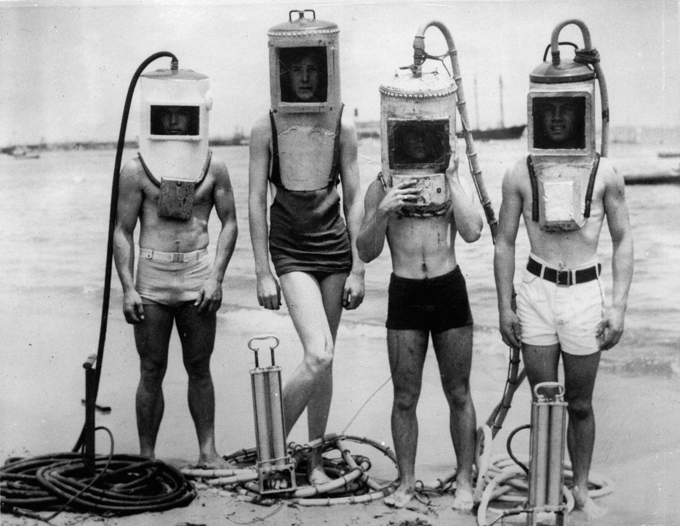 A group of boys made diving helmets from sections of hot water heaters, boilers and other easily secured "junk". Los Angeles. USA - June 23, 1933.