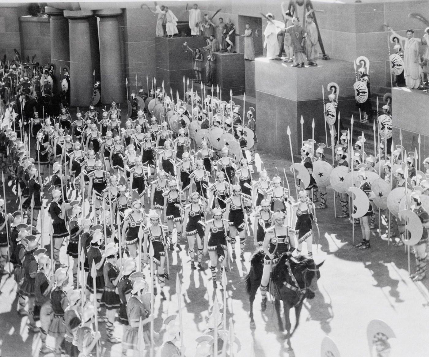 Actors in costume and horses during Amazon staging.