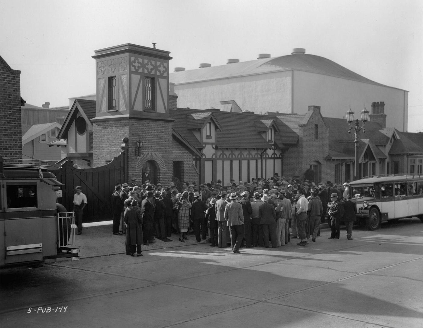 A bunch of people in front of Charlie Chaplin's studio in the heart of Hollywood