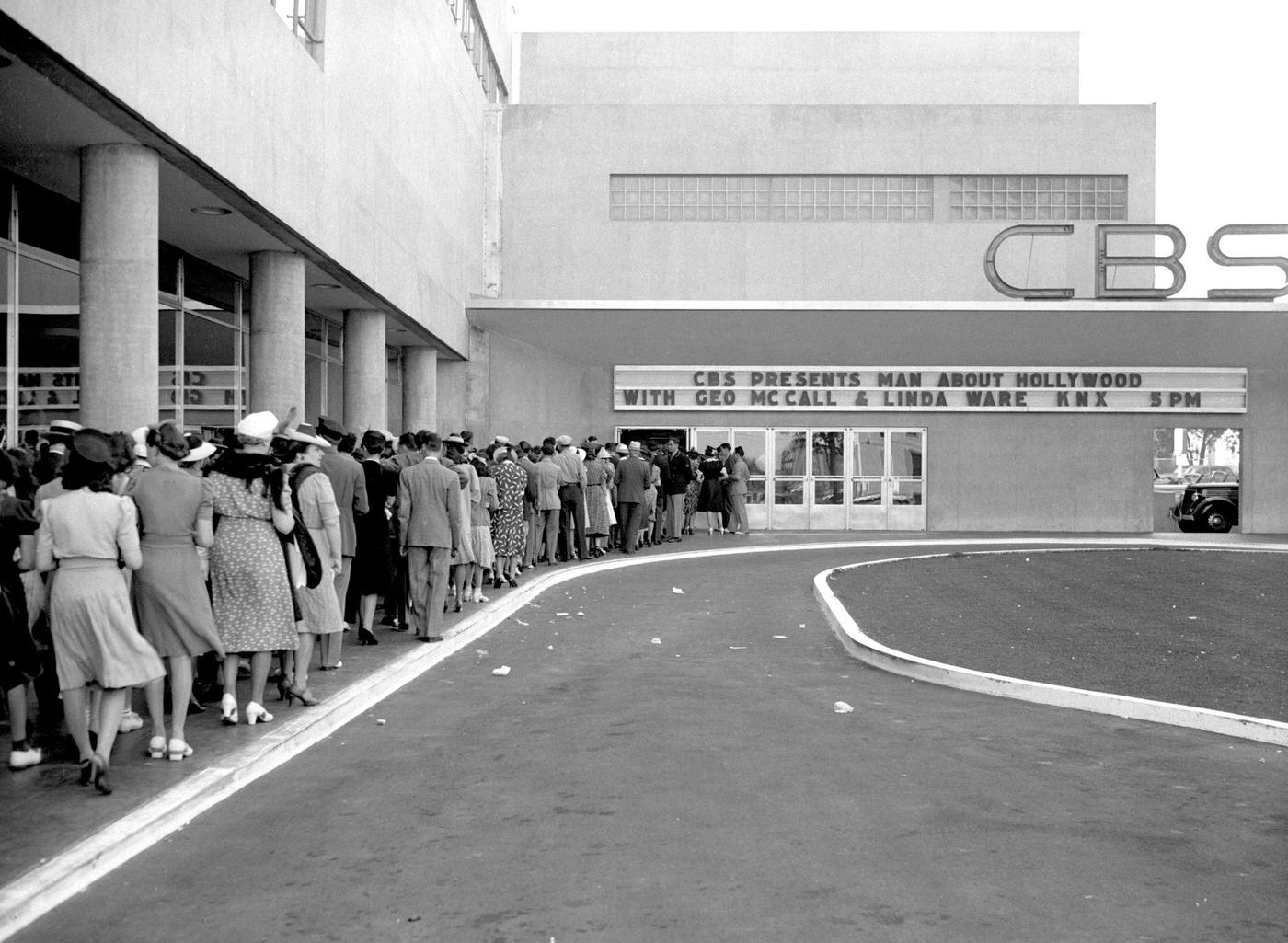 Audience members queue in line to enter the CBS Radio program, Man About Hollywood, which broadcasts from CBS KNX studios at Columbia Square, 1939.