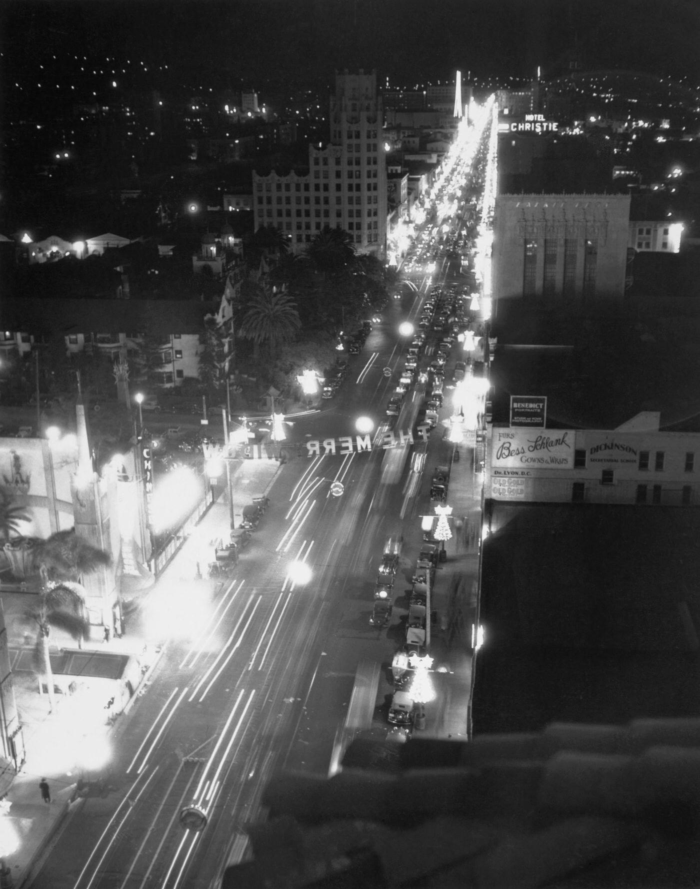 High angle view of the Santa Claus Lane Parade on an illuminated Hollywood Boulevard in Los Angeles, 1934.
