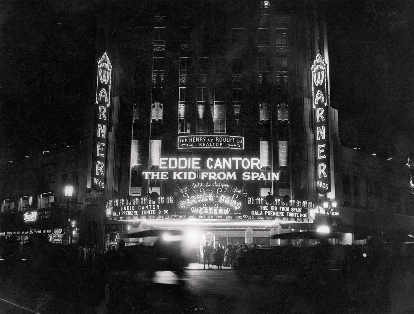 Crowds at the West Coast premiere of Eddie Cantor's The Kid from Spain at the Warner Brothers' Western Theater, on the corner of Wilshire and Western in Los Angeles, 1930s.