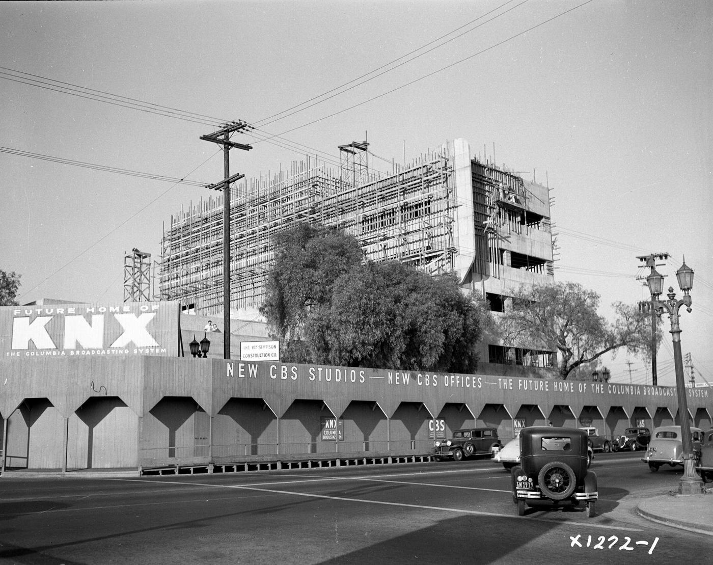 View of unfinished CBS Columbia Square KNX Art Deco style building, looking northwest from Gower Street, Los Angeles, 1938
