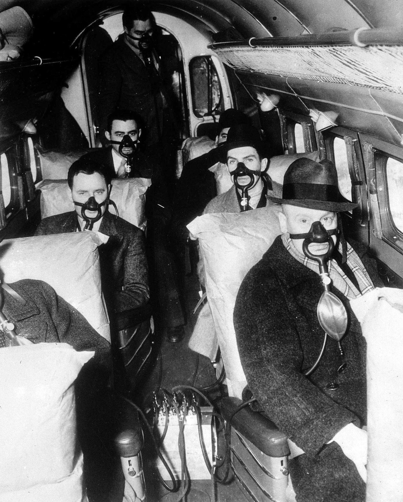 American Airline passengers make the first stratosphere flight test. The picture shows passengers breathing through their special masks during the flight.