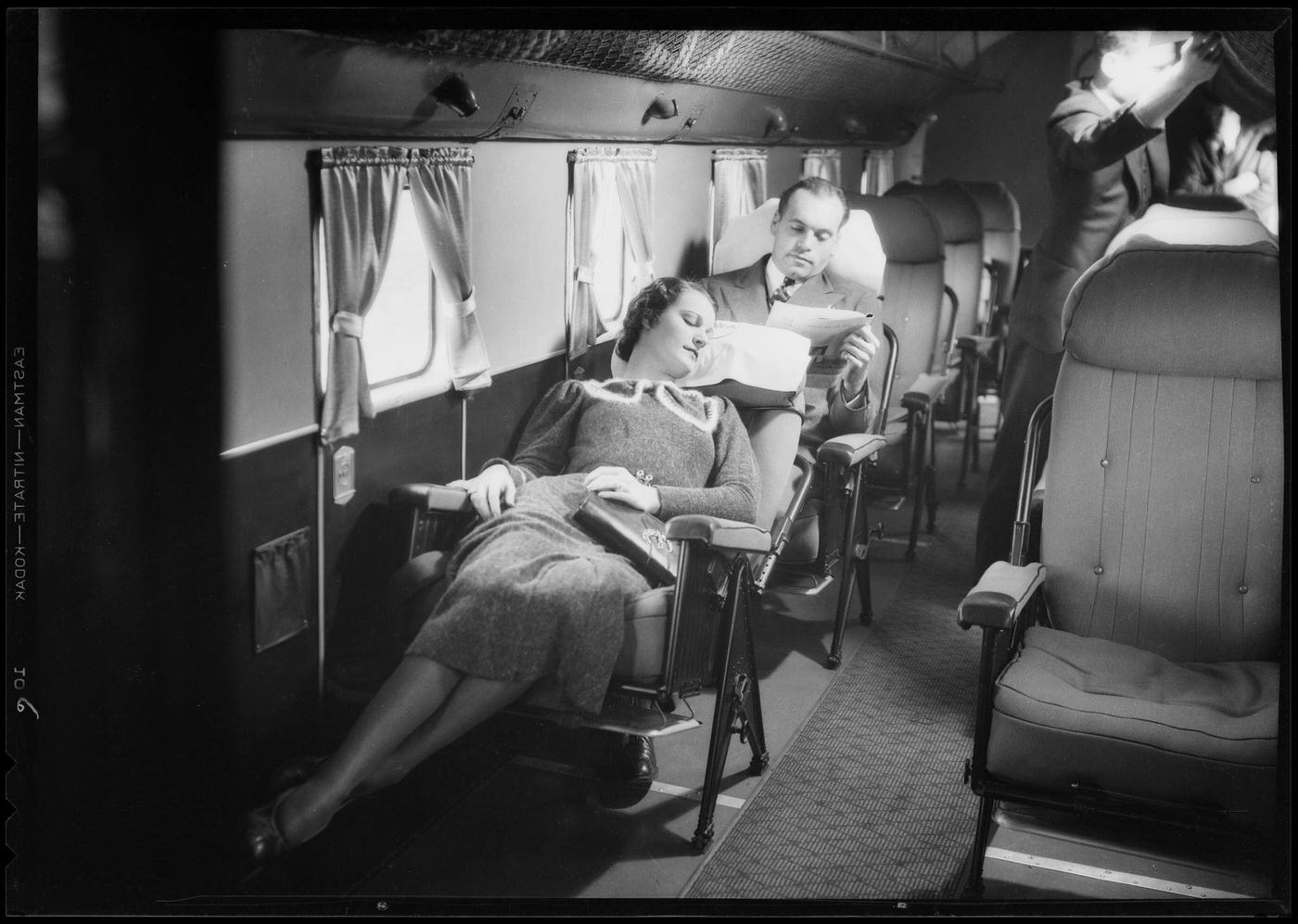 A customer reclines in the cabin of a Transcontinental & Western Air Douglas DC-1 Airplane.