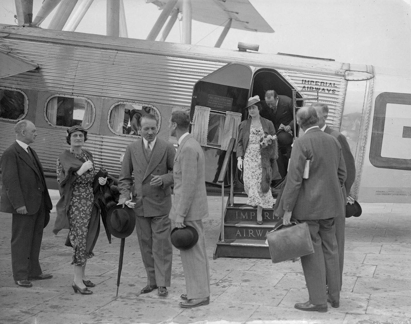 The Duke and Duchess of York alight from an Imperial Airways liner, on their arrival in England from Brussels, 1935