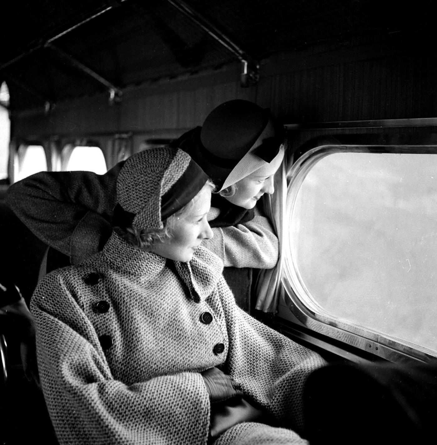 Women aboard an airplane between Paris and London, 1934