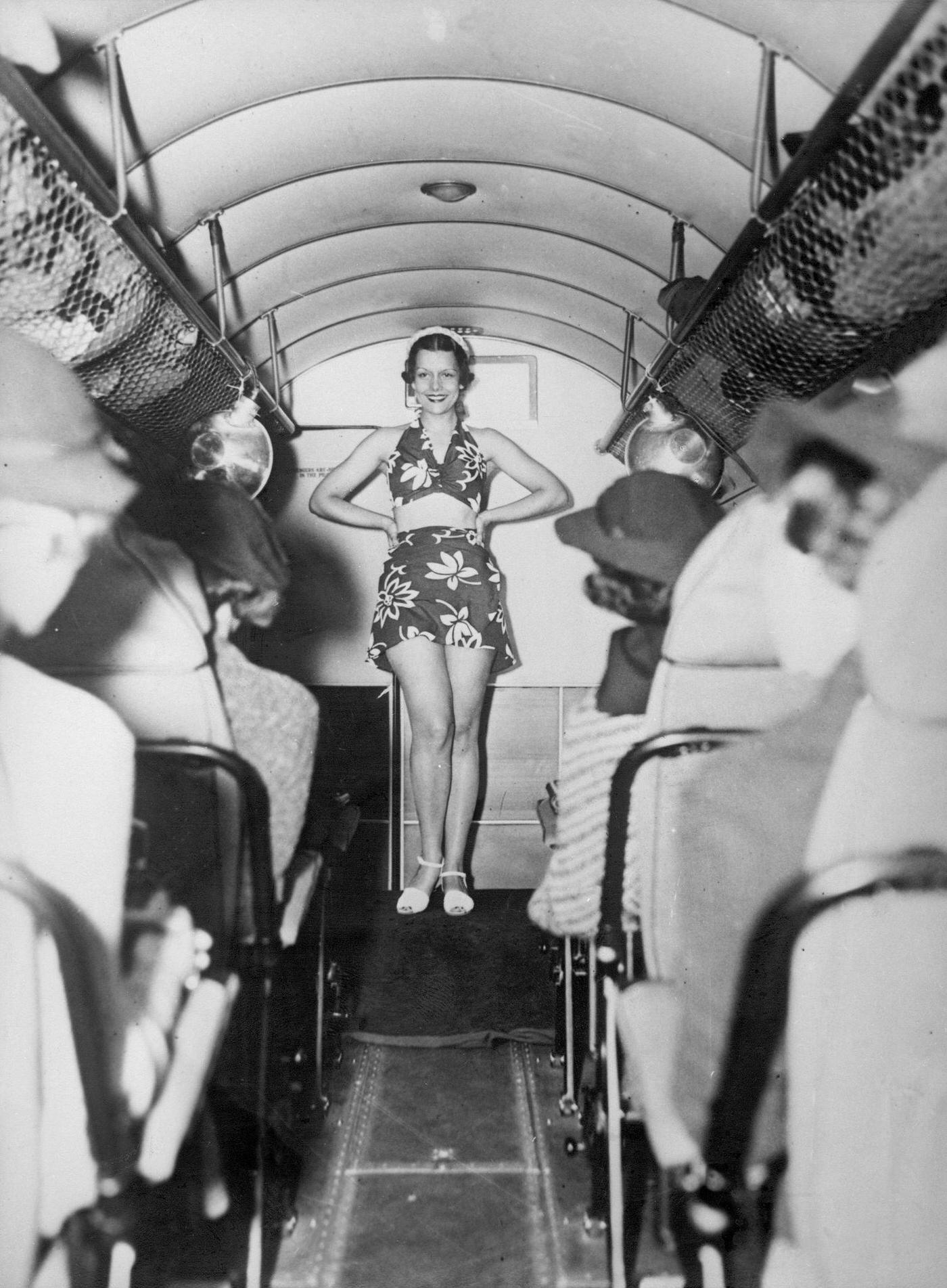 Passengers on a flight from New York to Miami are entertained with a fashion show featuring the latest beachwear in the air, 1930.