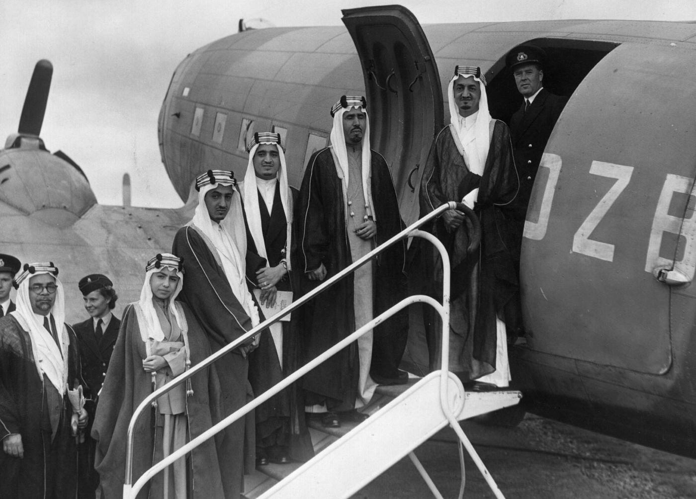 Five sons of King Abdul Aziz Ibn Saud of Saudi Arabia are shown boarding a plane at Herne Airport in Hampshire.