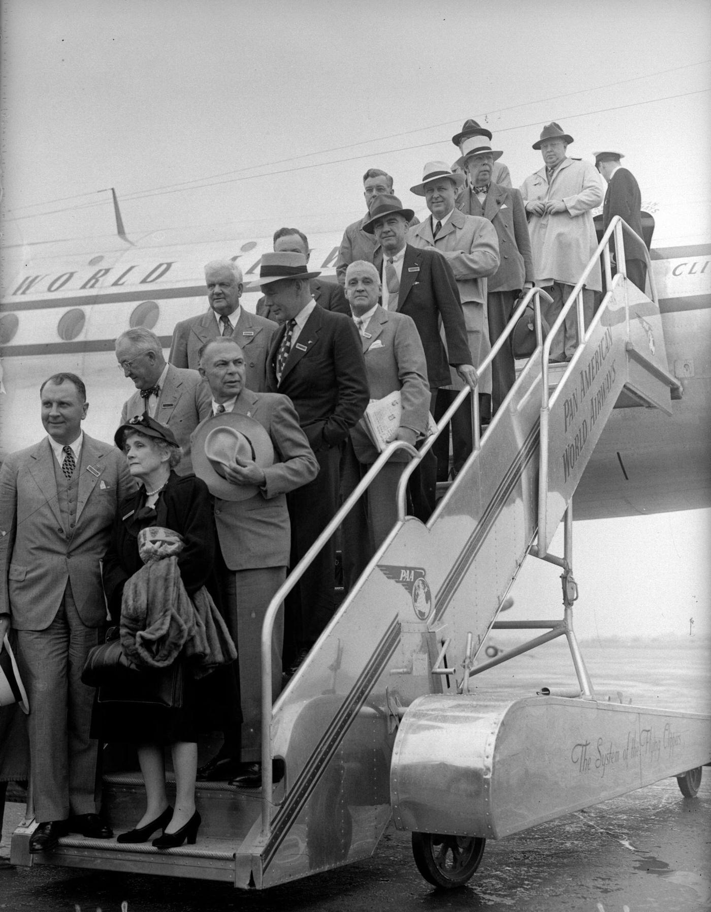 American newspaper editors are shown arriving in London during a round-the-world trip in 1947.