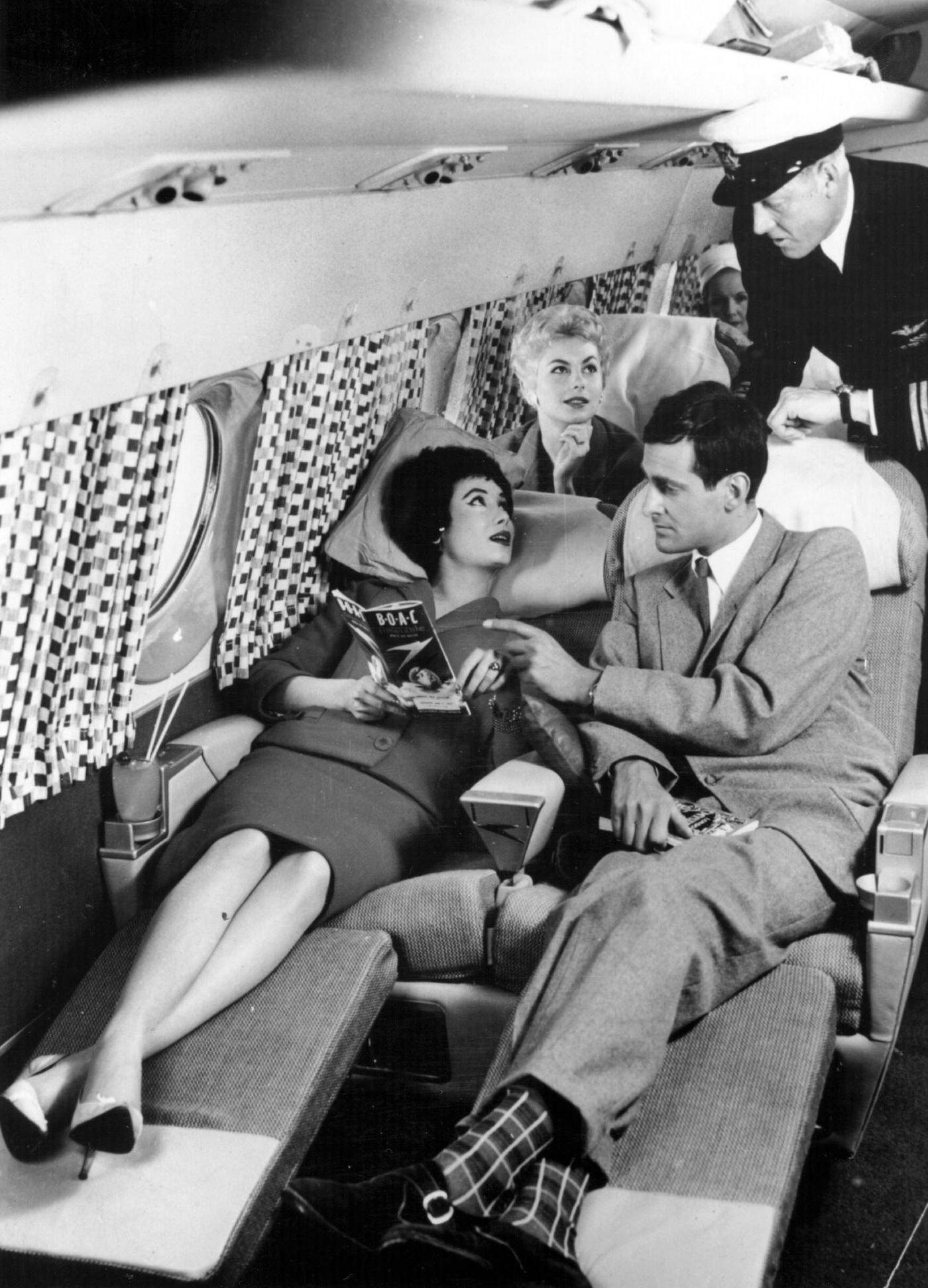 Passengers relaxing on the sleeper seats during a demonstration flight of the new Comet 4 at Hatfield in 1958.