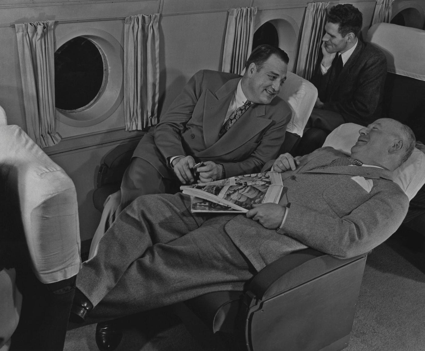 Passengers relax on a flight in 1950.