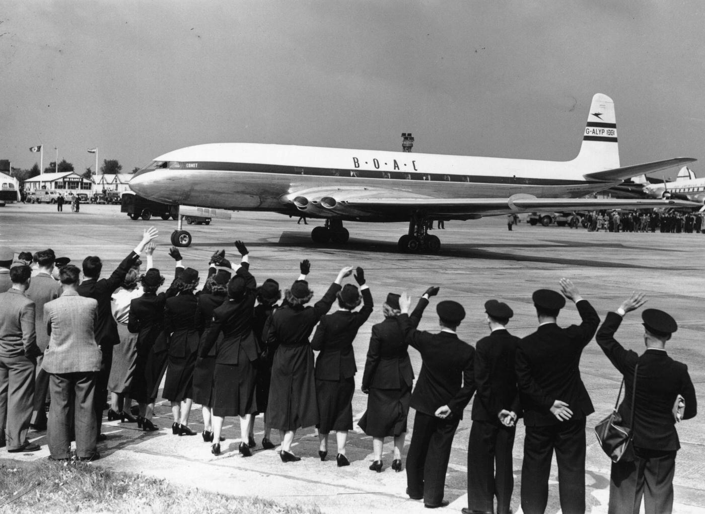 The BOAC Comet is seen taxiing on the runway at London Airport before flying to Johannesburg, marking the world's first jet passenger service.