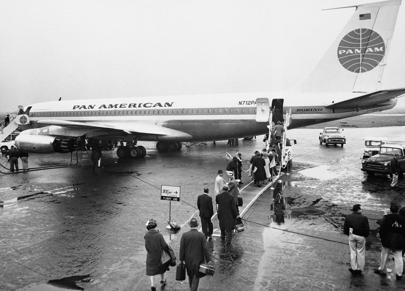 Passengers boarding the jet service to Paris from the Pan American World Airways 707 Jet Clipper, which inaugurated the airline's Trans Atlantic services to London on October 26, 1958.