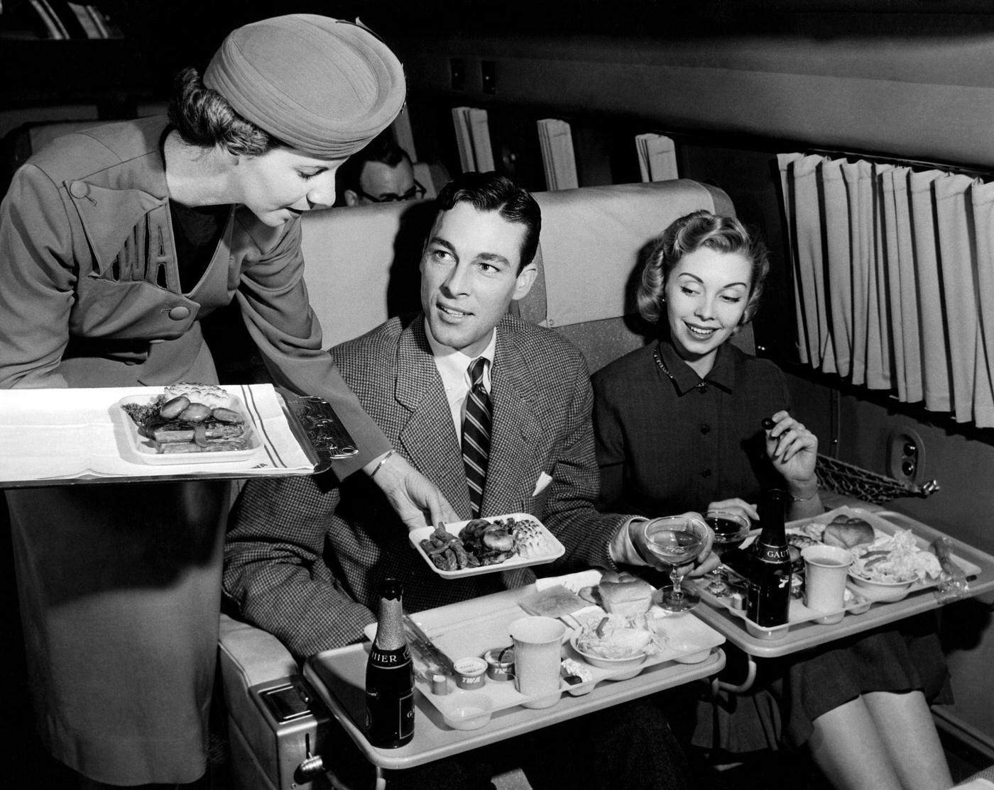 A couple on a plane in 1955.