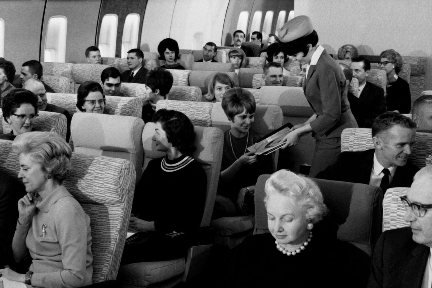 Passengers on a jumbo jet in 1960.