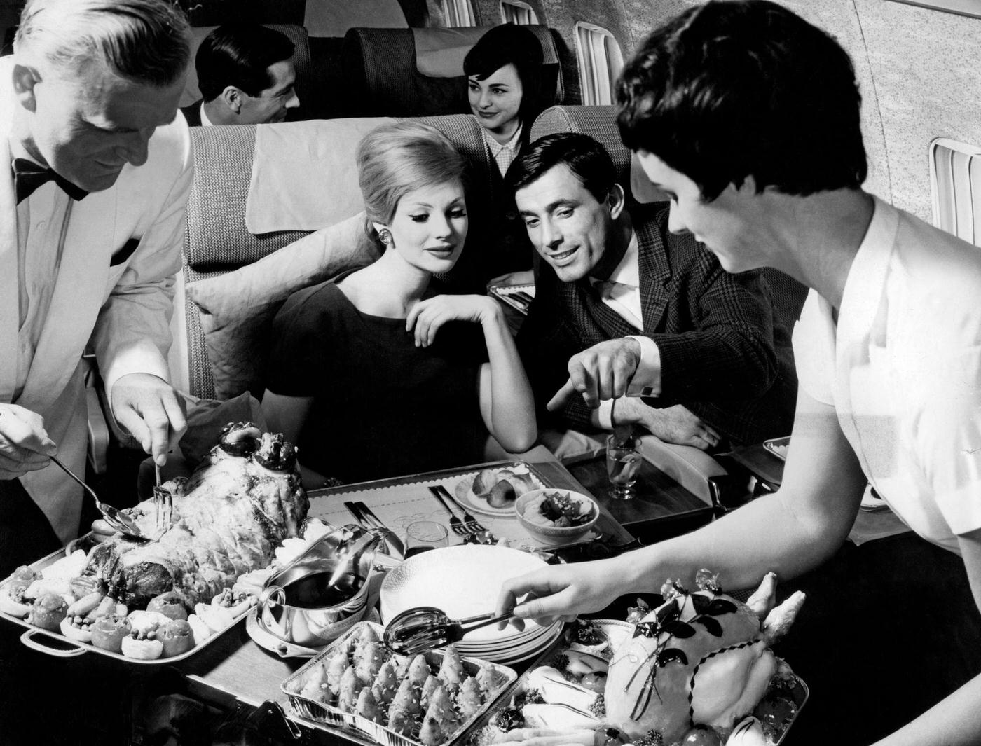 A couple on a British Overseas Airways Corporation plane in 1960.