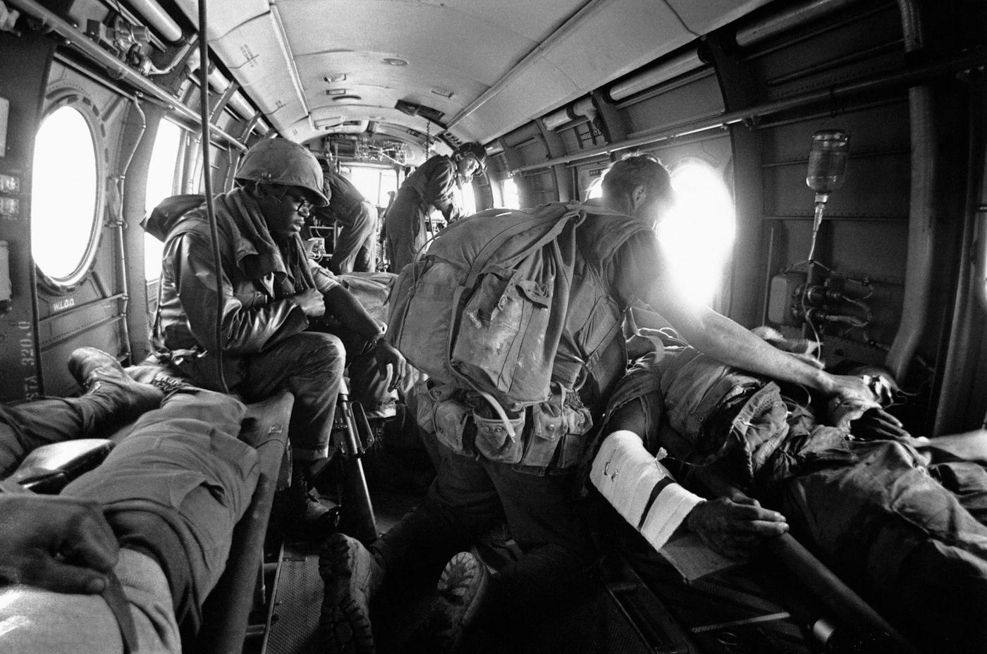 A US soldier wounded during the Vietnam War receiving an emergency blood transfusion on board a medical helicopter.