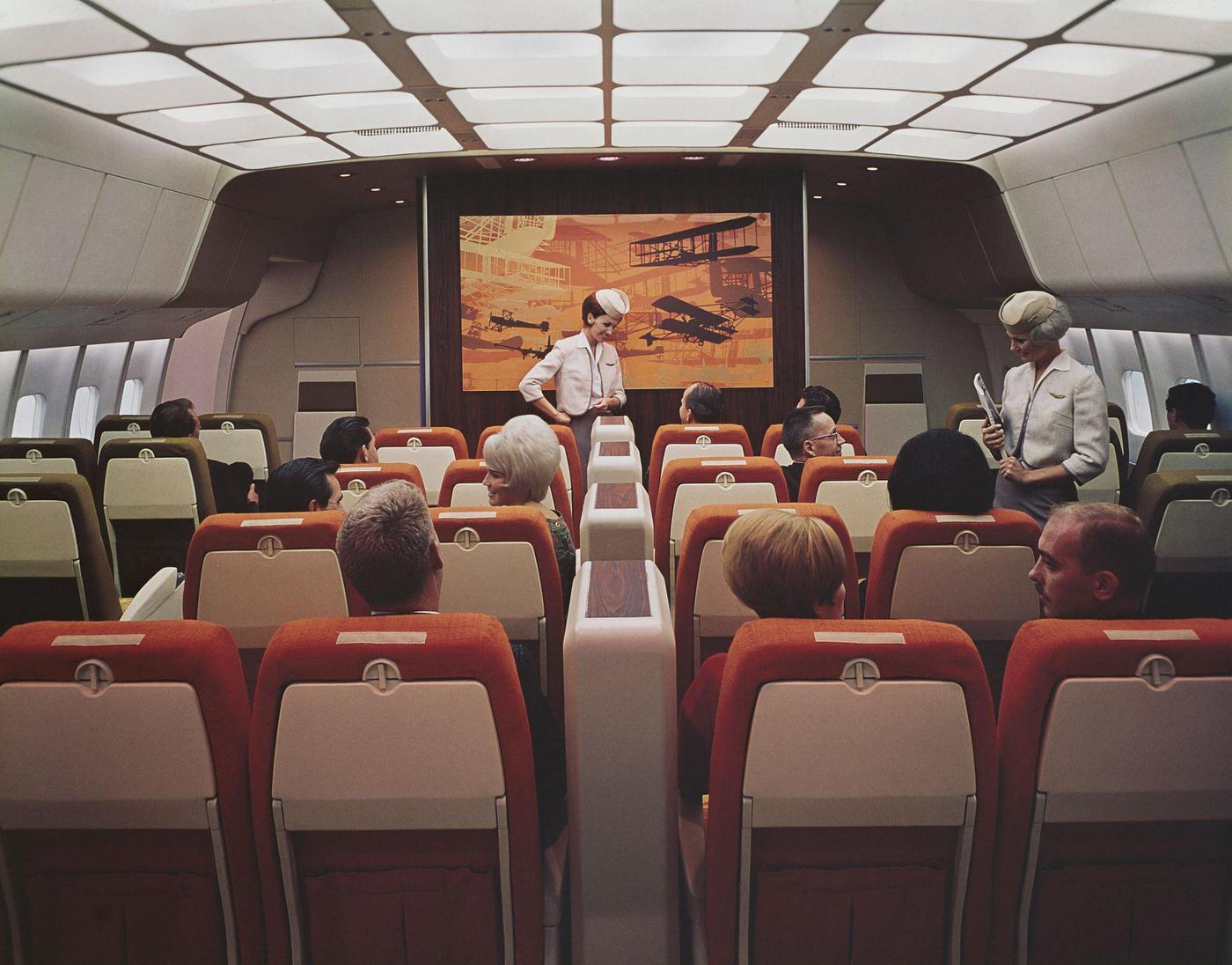 Passengers and flight attendants inside a mock-up interior of a Lockheed L-1011 TriStar passenger aircraft during its development work and design in the United States in 1968.