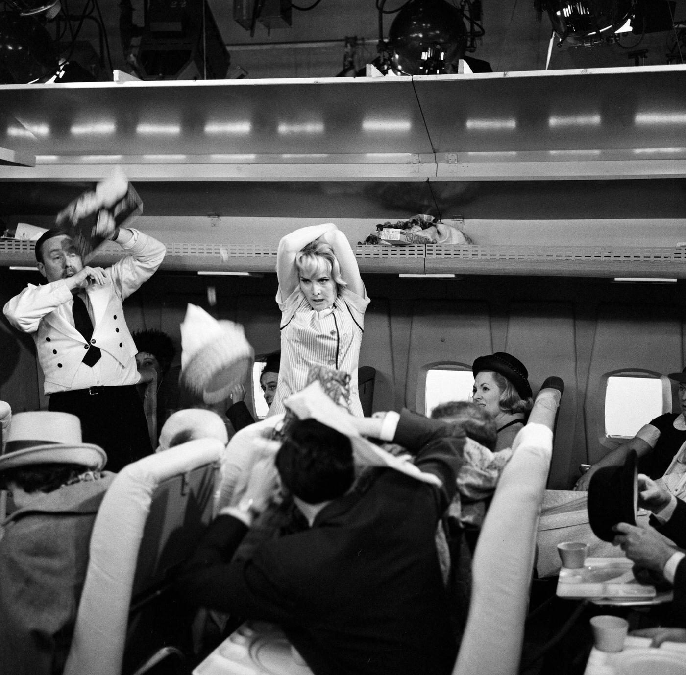 Sheila Hancock playing the role of an air hostess in scenes being shot for the comedy series "The Bed-Sit Girl" at BBC Studios on February 21, 1965.