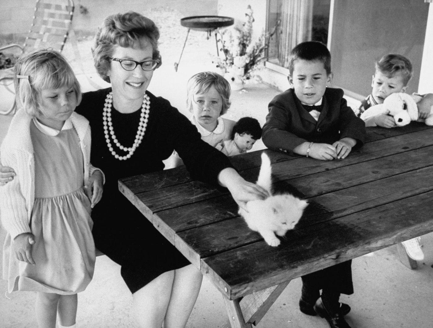 Mrs. James Webb, wife of a passenger on a Continental Airlines jet that crashed over Unionville, sitting with her children.