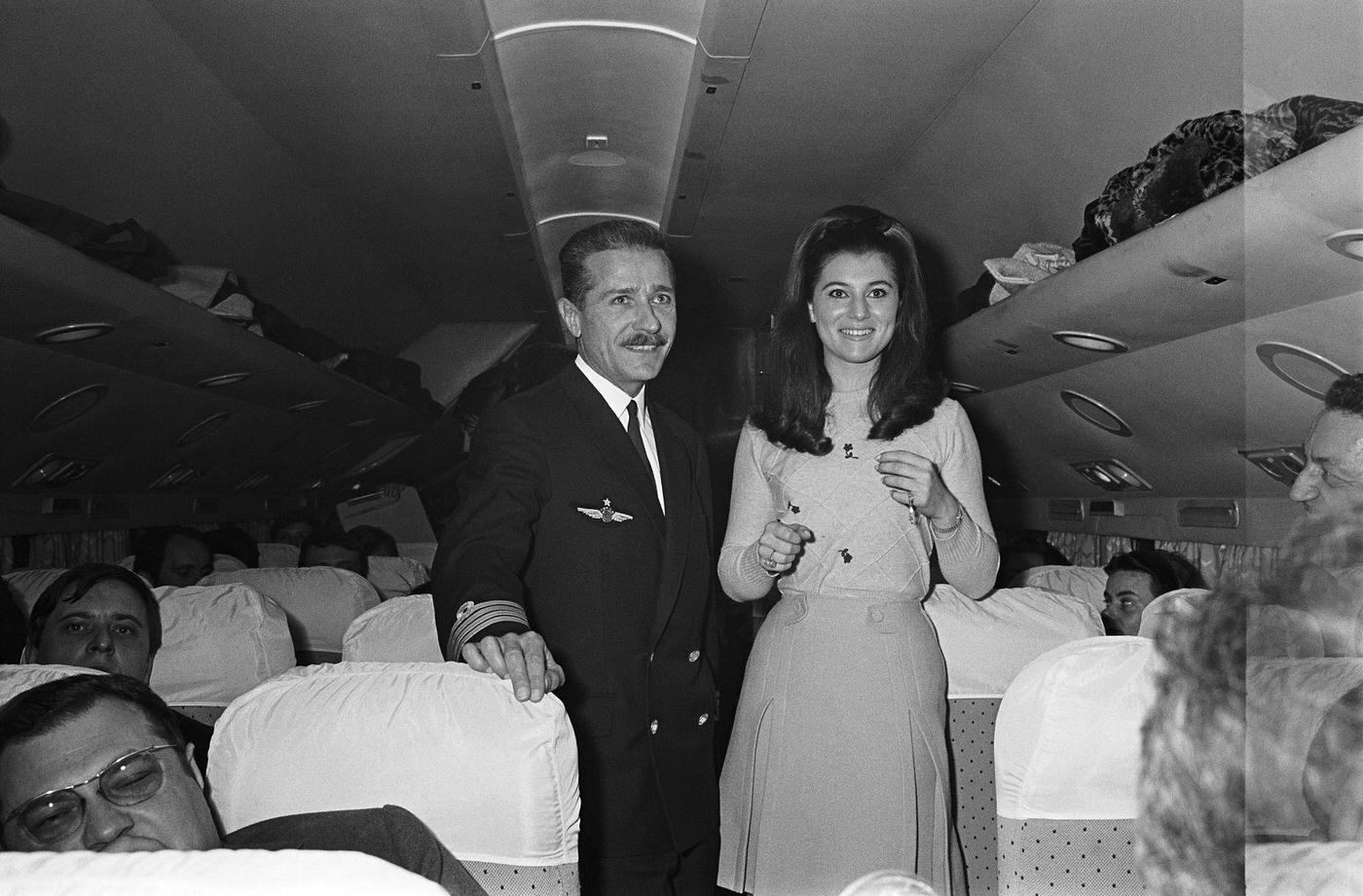 Sheila smiling next to the pilot of an airplane that brought her from Paris to Nice for the world premiere of the film "Bang-bang" in 1967.