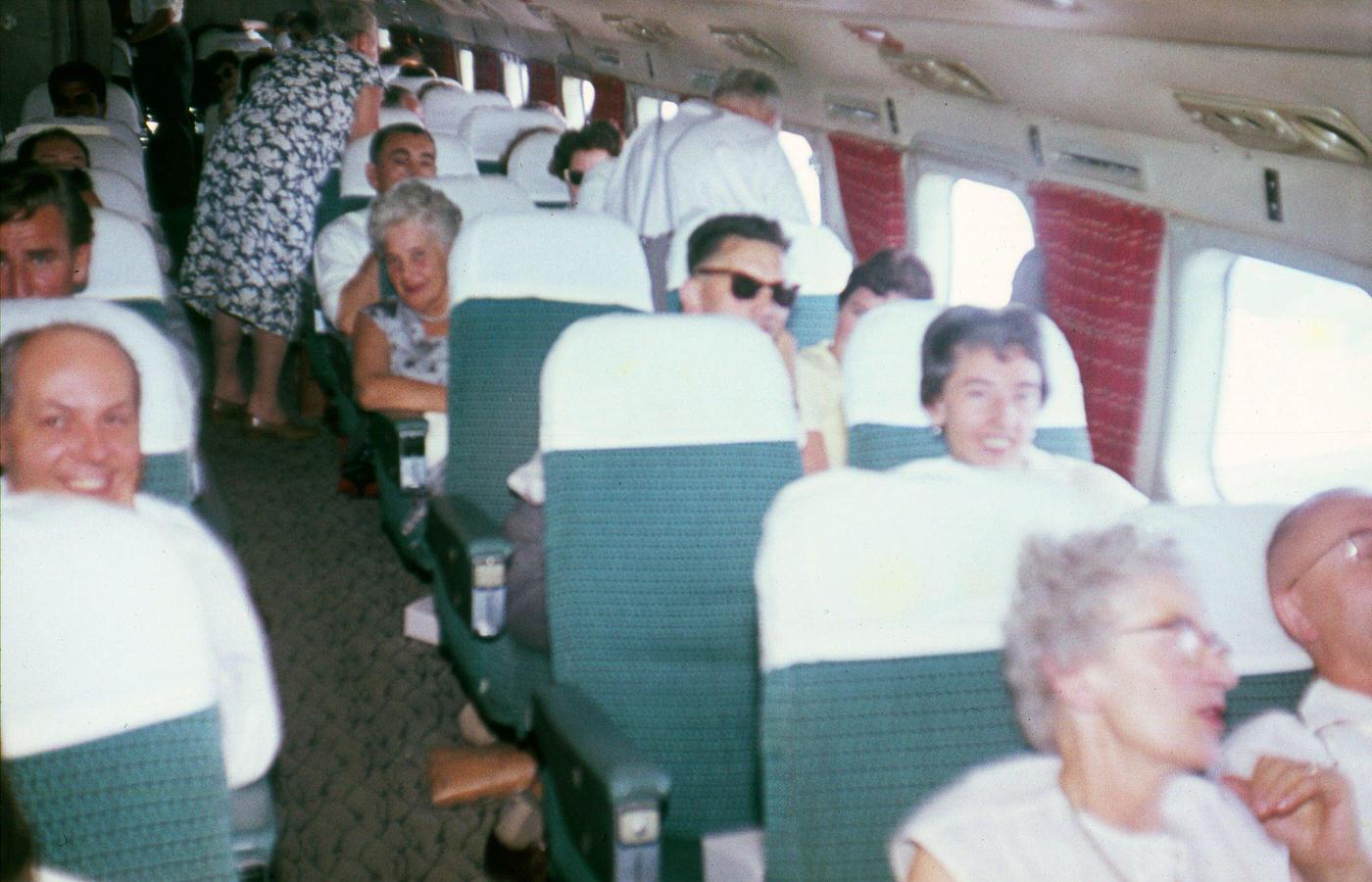 Passengers on airplane at Tempelhof Airport, Berlin, ca. 1960.