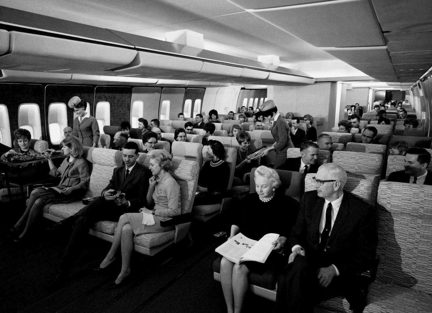 Passengers on a jumbo jet. 1960.