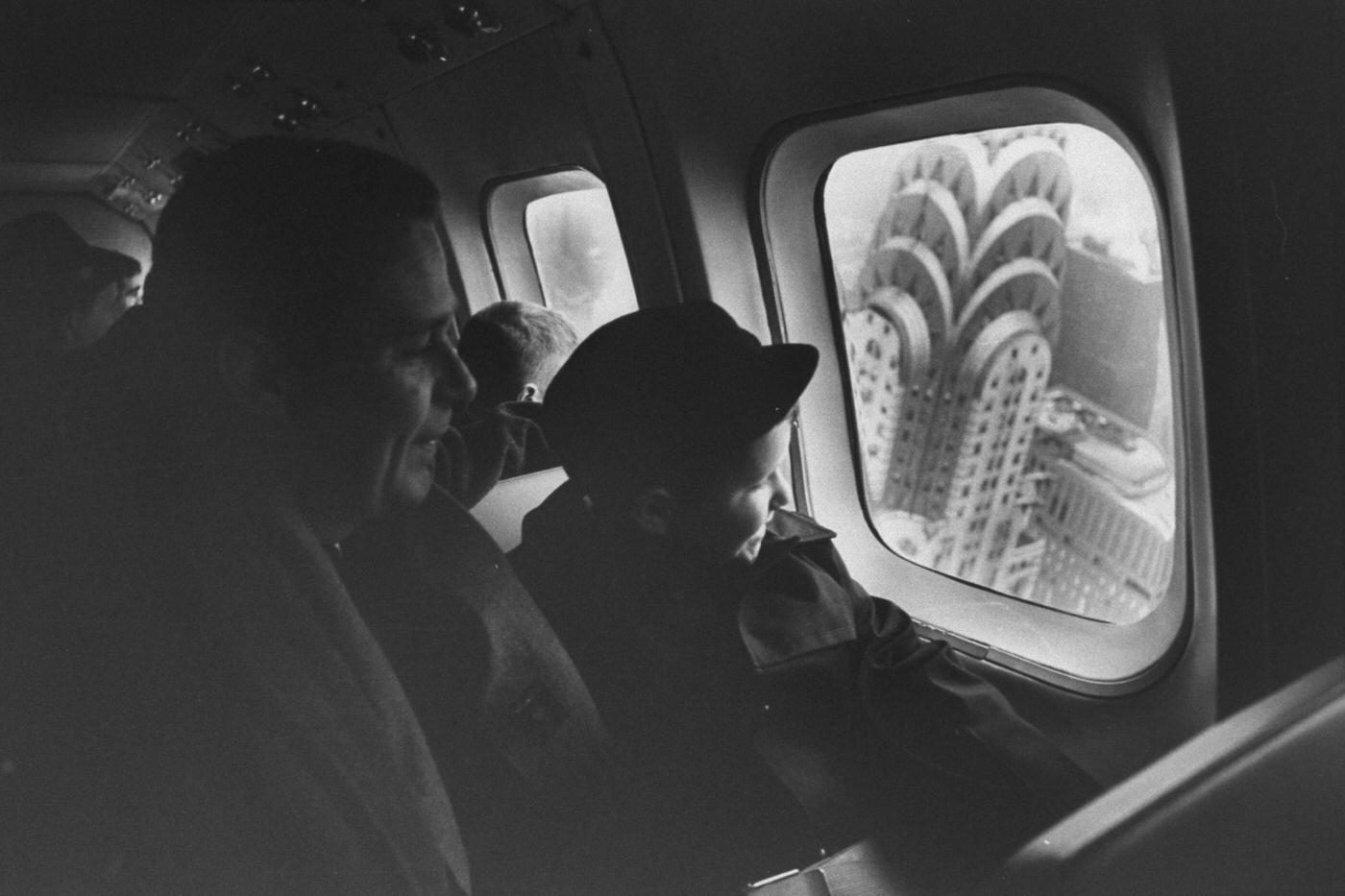 Passengers view New York City from the window of a helicopter taxi to New York airports.