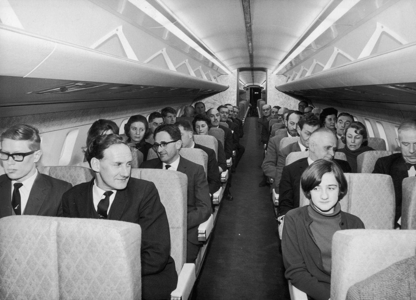 Passengers filling a full-scale model of the Concorde supersonic airliner at the British Aircraft Corporation factory in Filton, Bristol. February 24, 1967.