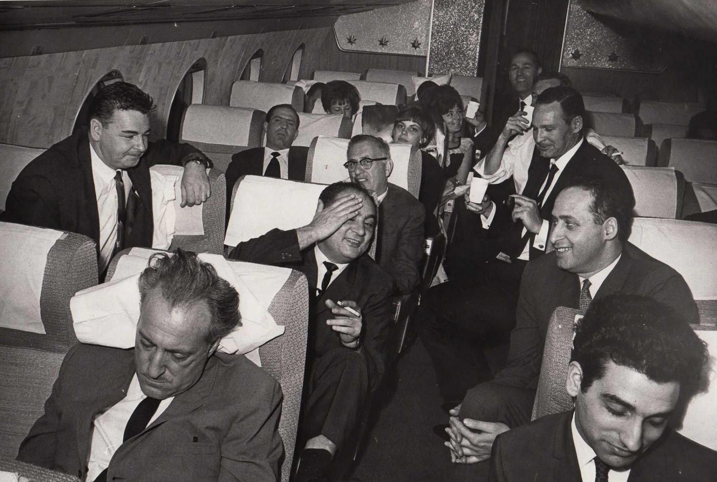 Passengers sitting on an Air Canada plane on the runway during the 1965 blackout in NYC. November 9, 1965.