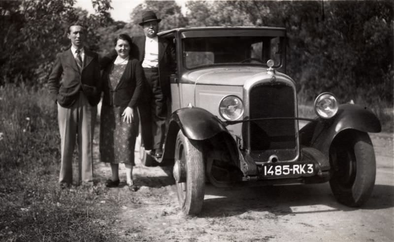 Three people with Citroën C4 in countryside, 1939