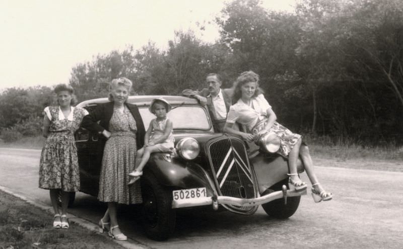 Belgian family with Citroën 11 CV on country road, 1947