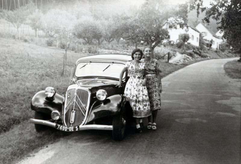 Two ladies with Citroën 11 CV on country road, Saarbrücken plates, 1950