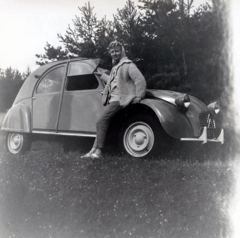 Lady with Citroën 2 CV in countryside, 1960