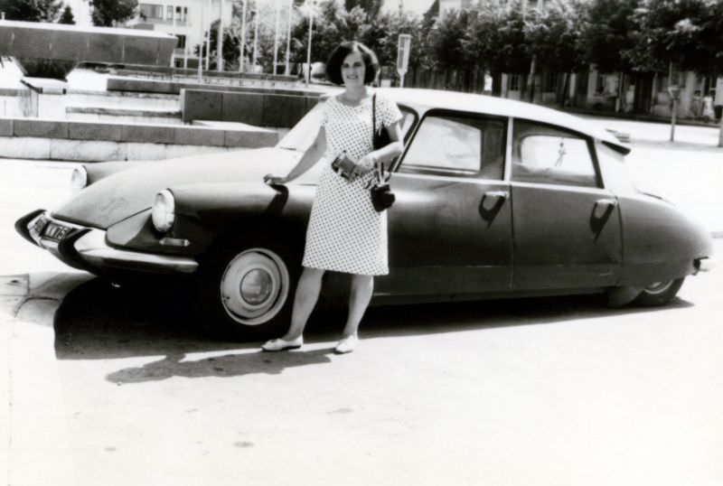 Lady with Citroën DS in city square in summertime, 1960