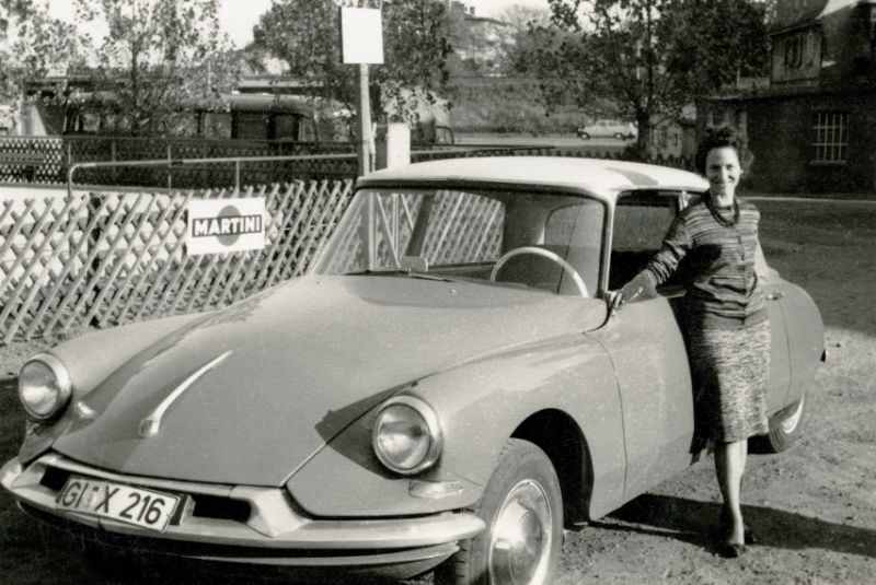 Young lady with Citroën DS in Gießen, West Germany registration, 1960