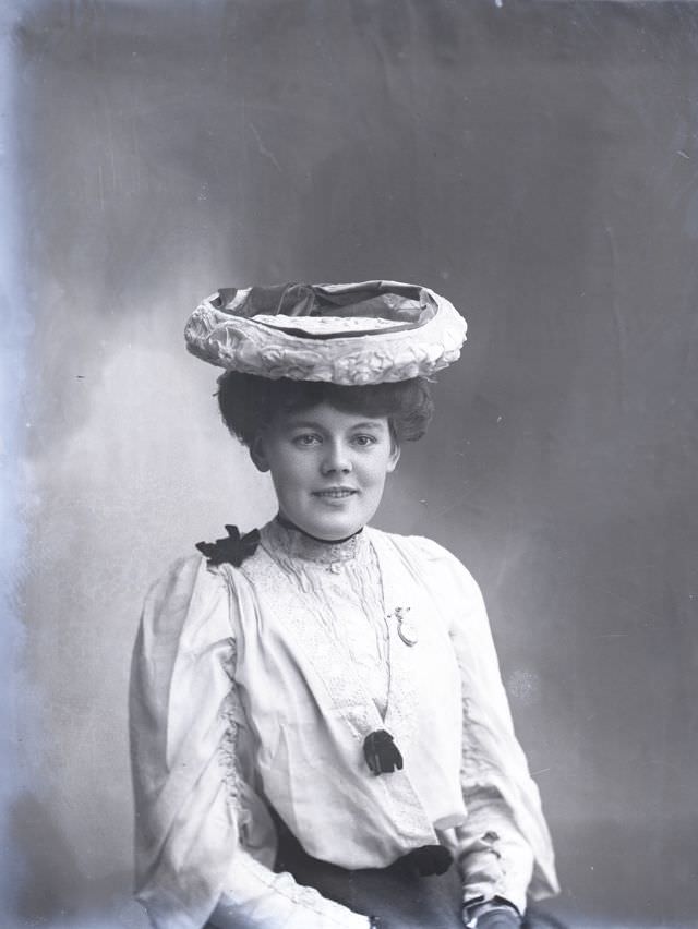 Miss Webber poses for a portrait circa 1900s