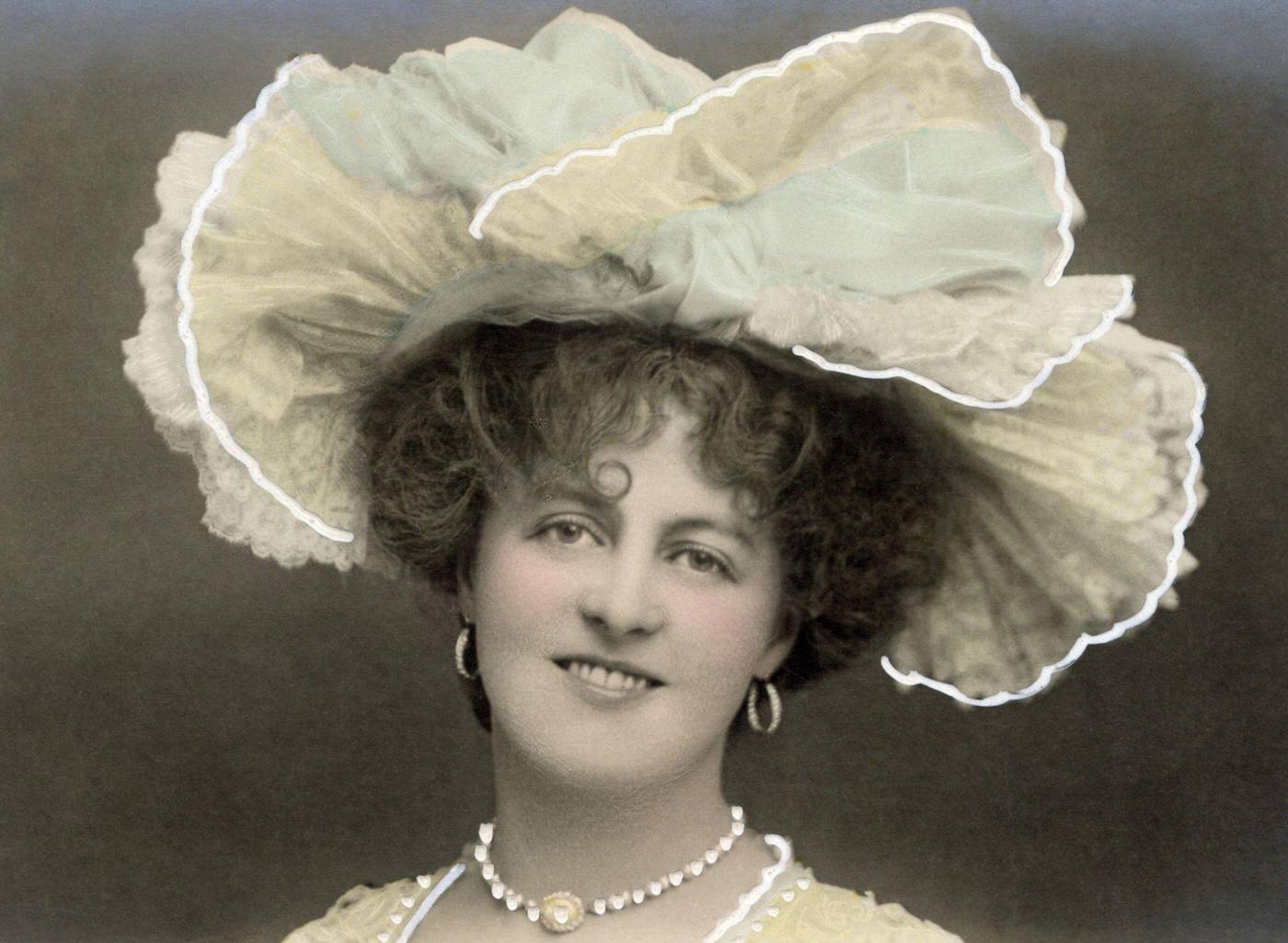 Marie Studholme, a renowned English actress and singer, looks stunning in her splendid hat