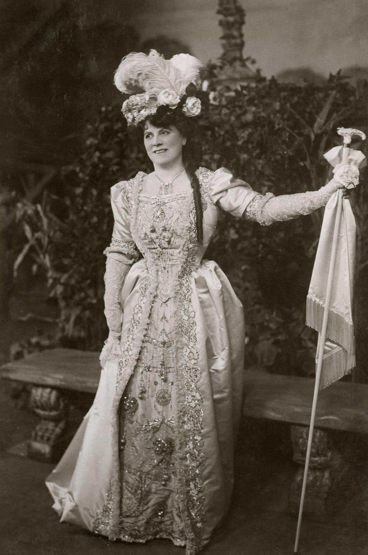 An Edwardian lady radiates beauty and grace in her fashionable hat