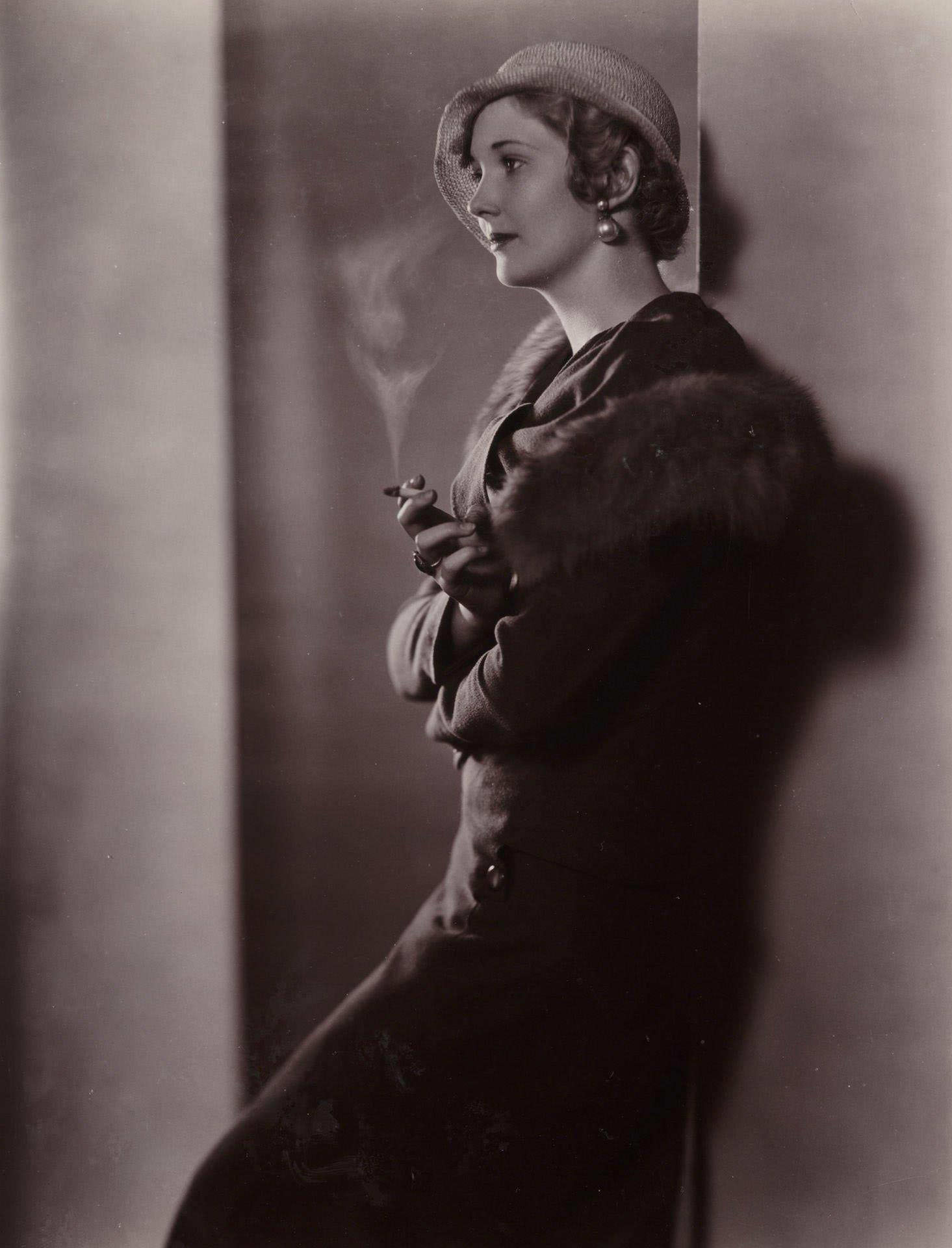 An Edwardian woman smokes a cigarette in this portrait from the 1900s