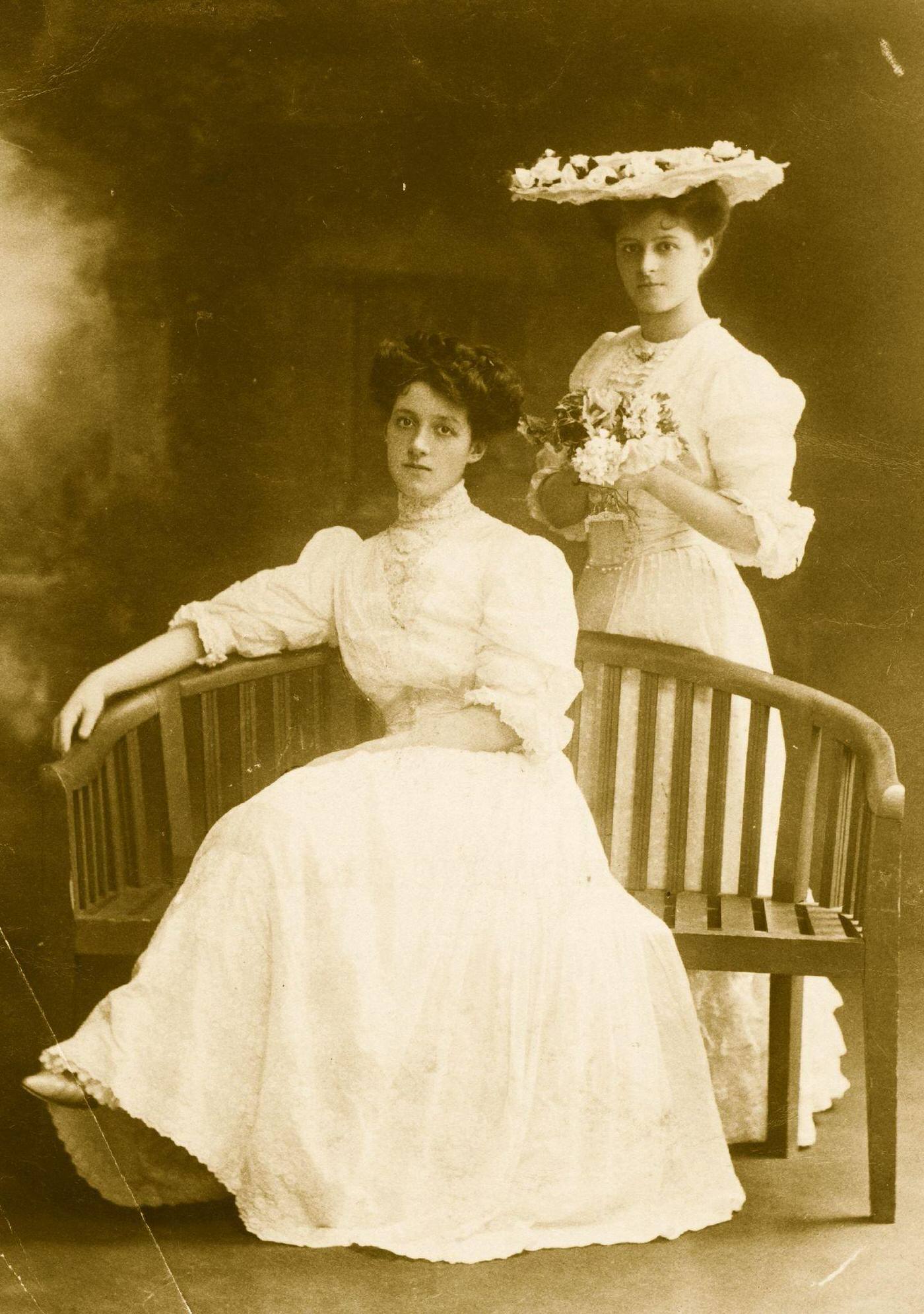 Two Edwardian ladies enjoy a day out in their summer day dresses