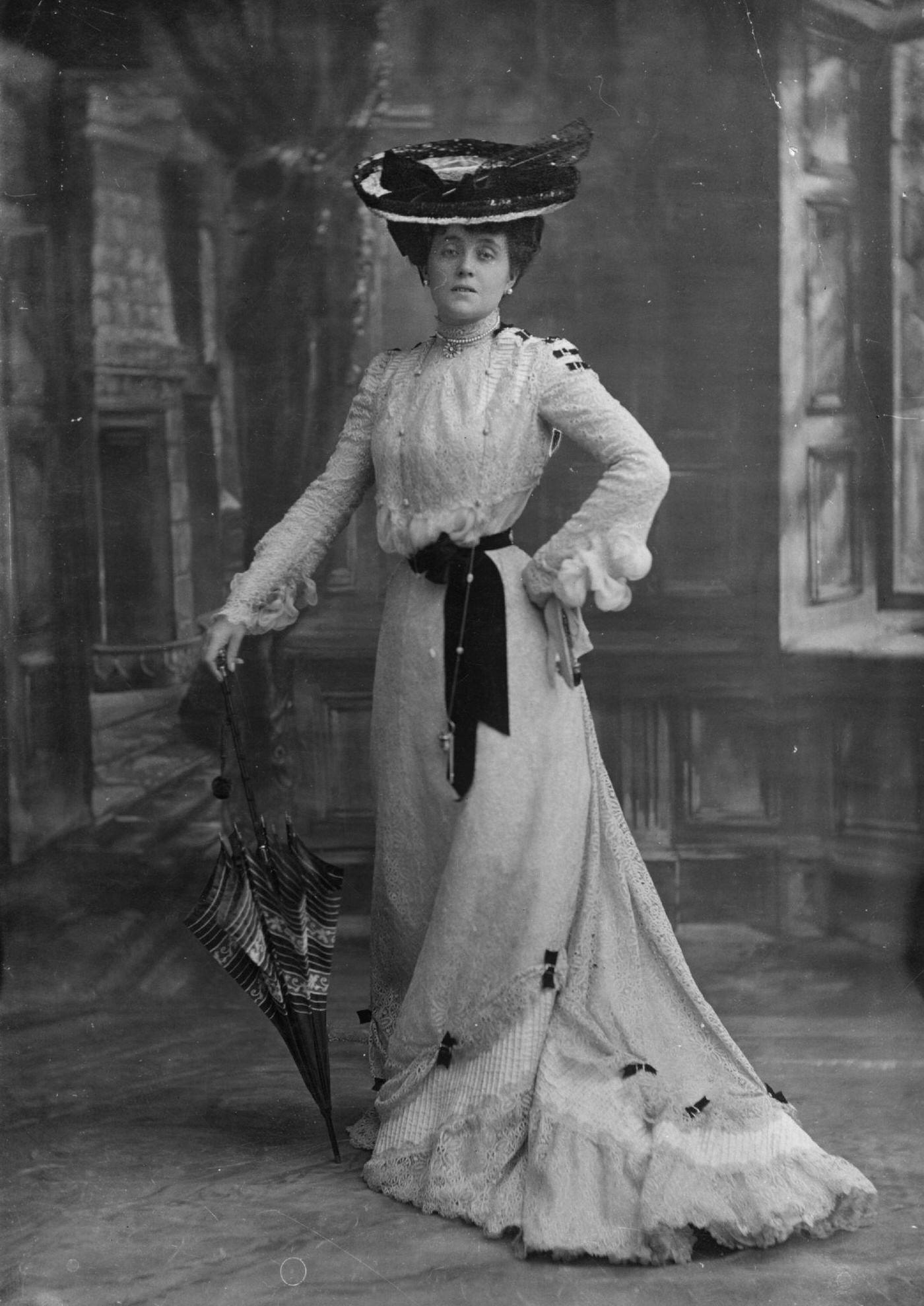 An Edwardian lady poses with a parasol in a timeless portrait