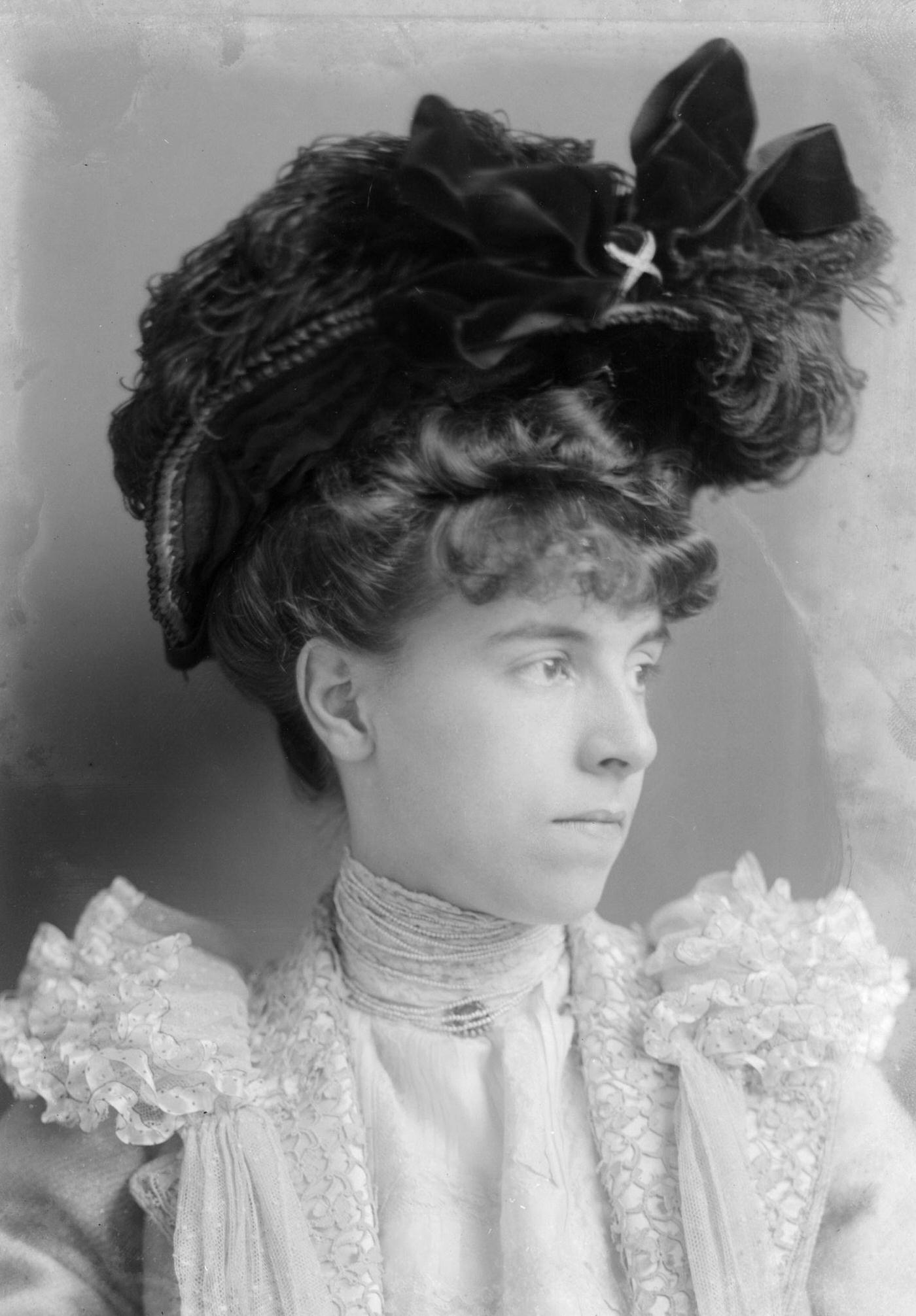 Miss M. Stephenson poses for a formal portrait wearing a typical Edwardian hat in 1902