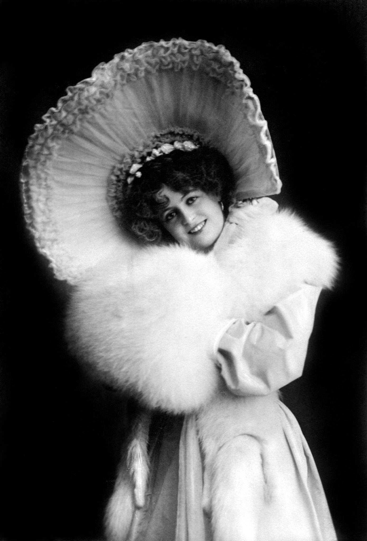 Marie Studholme poses with confidence in her stylish hat