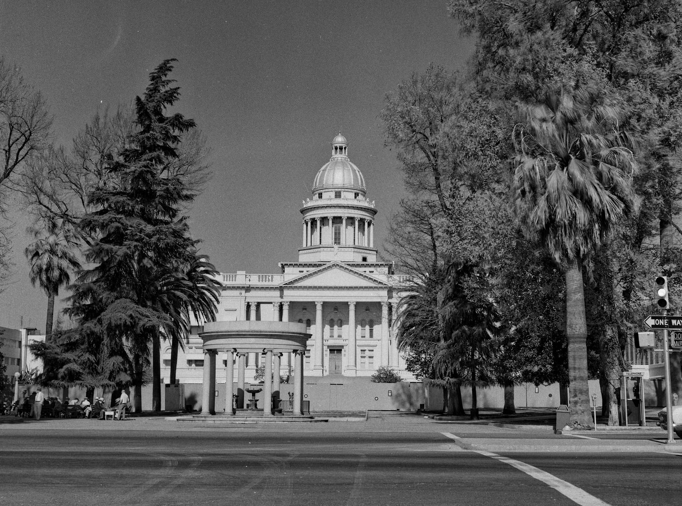 Last days of the old Fresno County Courthouse. The demolition contractor's fence is up and the tear down is ready to begin. As viewed from Van Ness Avenue.