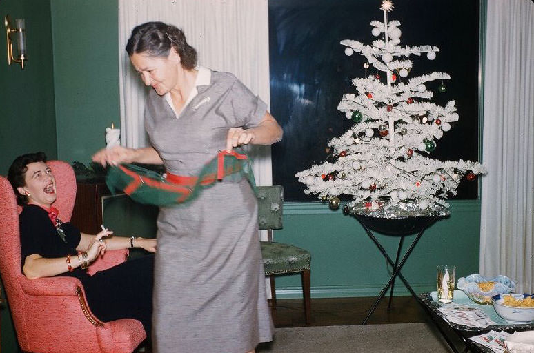 White flocked Christmas tree. Last names are Oliver and Kohler, 1950s